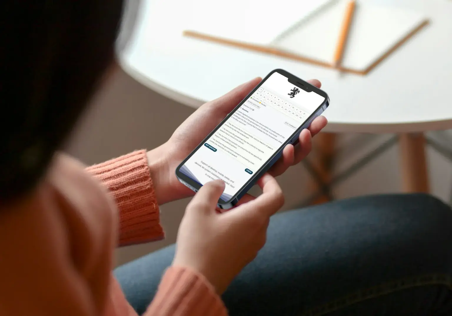 Student practicing horology exam questions on mobile phone